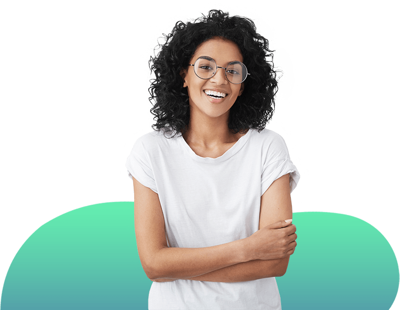 A smiling woman with her arms crossed